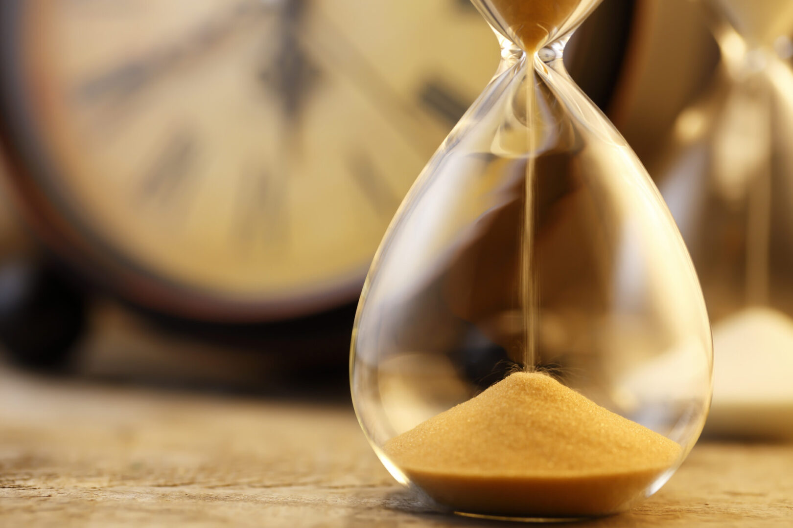 A close up of an hourglass with sand in it