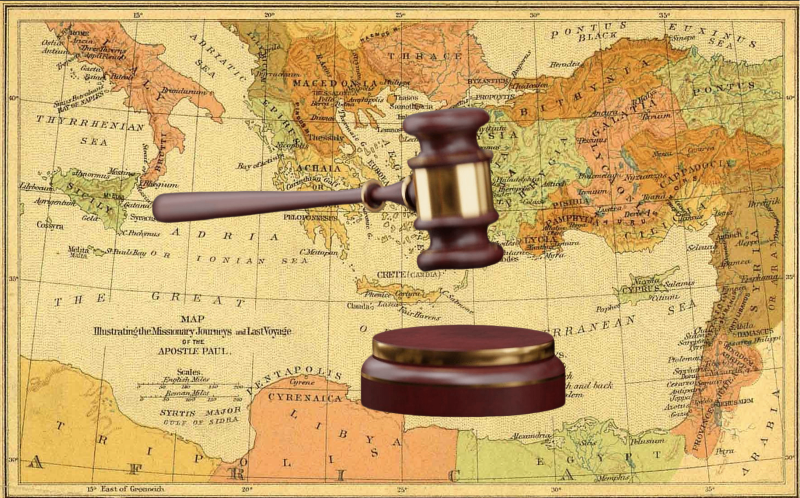 Gavel with world map in the background