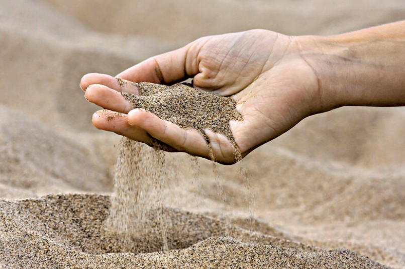 For Dust You Are, and Dust You Shall Return (Genesis 3) A handful of dust with some of it slipping through the fingers