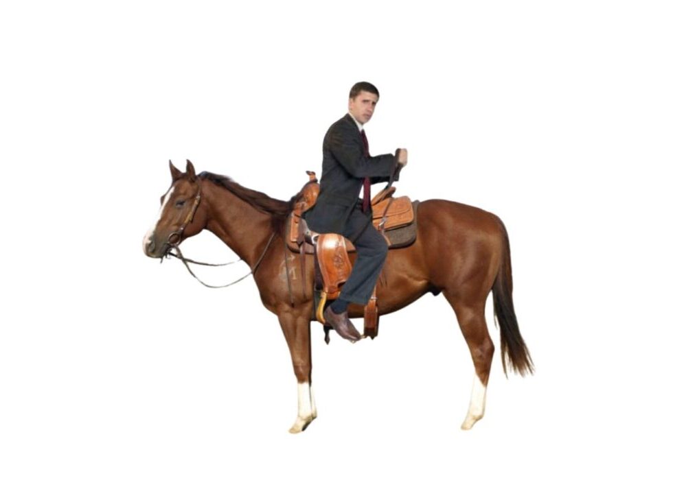 Man in suit riding horse backwards