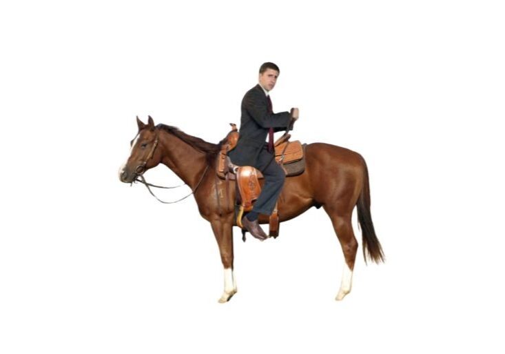 Confused man in suit riding horse backwards.