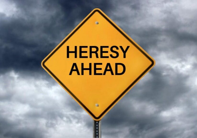 A yellow caution sign with the words "Heresy Ahead"