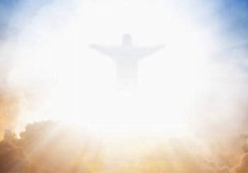 Jesus Will Not Return Until the Jews Accept Him as Messiah.docx Feint outline of Jesus with his arms spread, appearing amongst blue and red clouds.