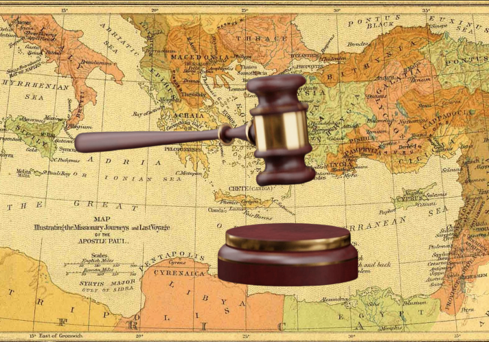 Gavel with world map in the background