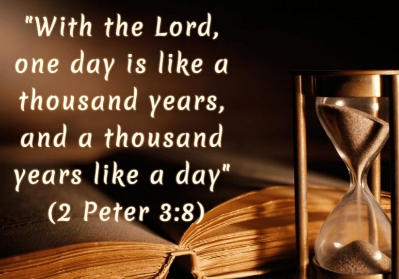 A sand timer next to an open Bible